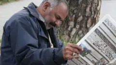 ਅਖ਼ਬਾਰ ਪੜ੍ਹ ਰਿਹਾ ਵਿਅਕਤੀ