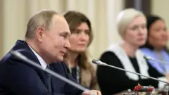 путін
