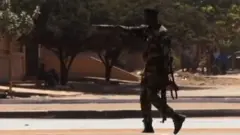 A soldier patrols the government palace area in Bissau, capital of Guinea-Bissau, on February 1 2022