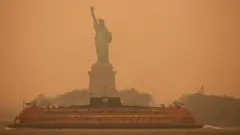 The Statue of Liberty is covered in haze and smoke caused by wildfires in Canada