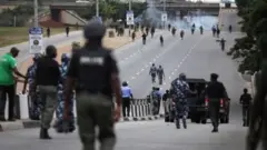 Police and Shiite members clash during protest