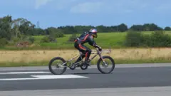 Neil Campbell being set off for his cycling speed record