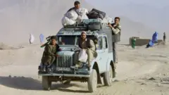 Same scene, different time... Afghans flee Kabul in 2001