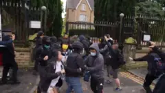 A still from a video shows a scuffle outside the consulate