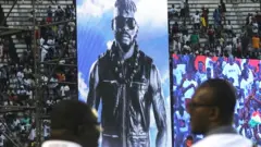Fans attend a tribute ceremony