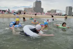 Domestic tourists visit the beach at Wonsan Kalma Coastal Tourist Area in Wonsan, North Korea's Kangwon Province on July 2, 2025. North Korea opened a massive resort area on its east coast, state media said on July 2, with the tourism pet project of leader Kim Jong Un reportedly set to welcome Russian guests later this month.