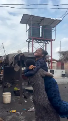 A woman carrying another woman