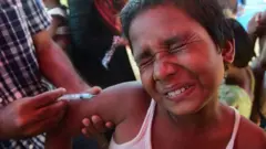 బాలుడికి గవద బిళ్లల వ్యాక్సీన్