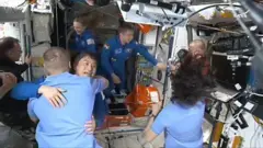 Hatch opens as replacements for Nasa's two stranded astronauts arrive at the ISS