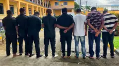 Eight dismissed police officers wey dey on parade for di Police Headquarters for Port Harcourt 