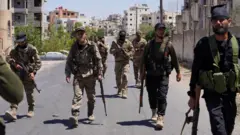 Syrian security forces patrol the southern city of Suweida on 17 July 2025