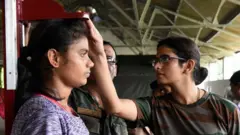 మహిళ