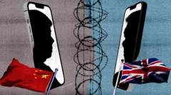 Çin ve Birleşik Krallık bayrakları, iki cep telefonu arada dikenli teller