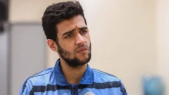 امیرعلی میرجعفری، از بازداشت‌شدگان اعتراضات دی ماه؛ عکسی که میزان، خبرگزاری رسمی قوه قضائیه ایران، منتشر کرد