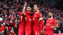 Liverpool dey siddon for di top of di Champions League table