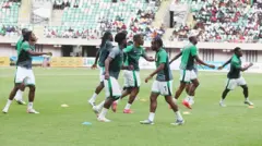 Players of di Super Eagles warm up during di 2026 Fifa World Cup Qualifing match between Nigeria Super Eagles and Rwanda Amavubi, wey Nigeria win 1-0, for di Godswill Akpabio Stadium.