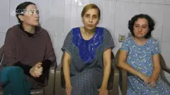 Three hostages seen in Hamas video