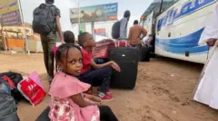 girl waits in khartoum