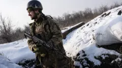 A Ukrainian soldier on patrol