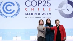 From left, Spain's minister for the ecological transition, Teresa Ribera, COP President Carolina Schmidt and UN climate chief Patricia Espinosa