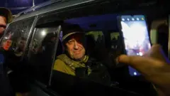 Wagner mercenary chief Yevgeny Prigozhin leaves the headquarters of the Southern Military District amid the group's pullout from the city of Rostov-on-Don, Russia, June 24, 2023.