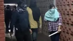 মুখোশধারীরা ক্যাম্পাস চত্বরে ঢুকে এলোপাথারি মারধোর শুরু করে।