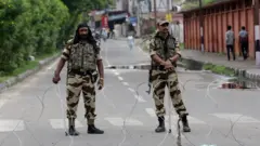 Indian paramilitary soldiers stand guard during a curfew in Jammu, Kashmir, India, 06 August 2019