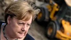 Angela Merkel in Schuld