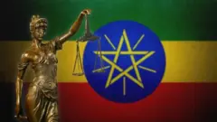 የፍትሕ ሚዛን የያዘች ሴት