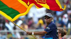 In this photograph taken on July 19, 2022, Sri Lanka's cricket fan Percy Abeysekera watches the fourth day play of the first cricket Test match between Sri Lanka and Pakistan at the Galle International Cricket Stadium in Galle