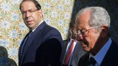 رئيس البرلمان التونسي محمد الناصر (يمين) بعد أداء اليمين الدستورية كرئيس مؤقت مع رئيس الوزراء يوسف شاهد