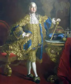 Francisco Esteban vestido con un traje azul y dorado, medias blancas, cetro apoyado en mesa