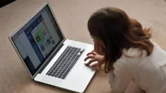 Child with laptop