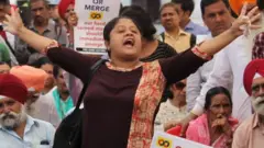 An account holders of the Punjab and Maharashtra Co-operative Bank (PMC Bank) shout slogans during a protest against Reserve Bank of India (RBI) in Mumbai, India on 30 October 2019.