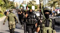Milicianos palestinos en Ciudad de Gaza