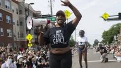 Demonstrators marching to defund the Minneapolis Police Department dance on University Avenue on June 6, 2020 in Minneapolis