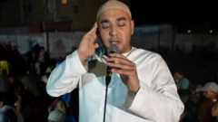 A man calling Muslims to prayer in Manenberg, Cape Town - South Africa