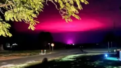 Locals in the town of Mildura were confused by a pink glow in the sky 