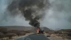 ኣብ ኲናት ዝነደደት መኪና