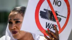 ኣይፋል ንዂናት ዝብል ምስሊ ዝሓዘት ሱዳናዊት
