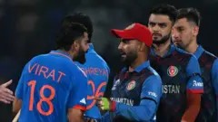 কোহলি আর নাভীন আগুনে ঘি না ঢেলে সৌহার্দ্য বিনিময় করলেন