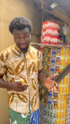 A man in front of sachet alcoholic drinks