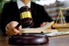 Judge gavel with Justice lawyers, Businessman in suit or lawyer working on a documents. Legal law, advice and justice concept.