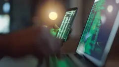 mock up of a computer screen and phone screen hacking