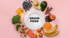 Best foods for brain and memory on pink background. Food for mind and charge of energy.