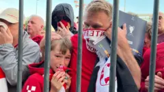Liverpool fans queueing outside the Stade de France