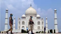 Indian security personnel stand guard at the Taj Mahal in Agra, Uttar Pradesh, India, 21 September 2020