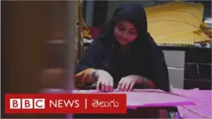 గాలిపటాలు తయారు చేస్తున్న మహిళ