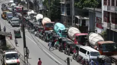 Drivers wait in long queues at a petrol station in Colombo, Sri Lanka on June 18, 2022, due to fuel shortages amid the country's economic crisis.