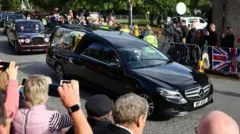 The Queen's funeral cortege is observed